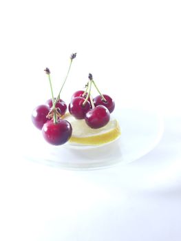 Photo cherry and lemon. Healthy food. Vegetarian red food. Berries and fruits. Berry for snack. 
