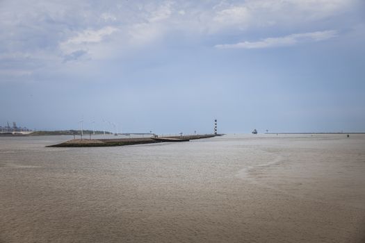 entrance to the harbor of europoort rotterdam form the nothsea to the waterweg river , the port name is maasvlakte or rotterdam port