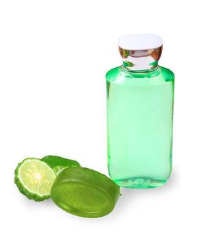 Kaffir lime or bergamot soap with bottles essential shampoo isolated on white background, clipping path.