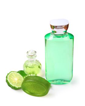 Kaffir lime or bergamot soap with aromatic spa of bottles essential shampoo isolated on white background, clipping path.