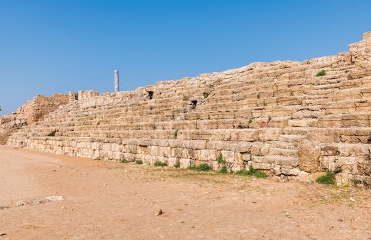 Fragment of the old tribunes of the arena at the ruined city of Caesarea in israel