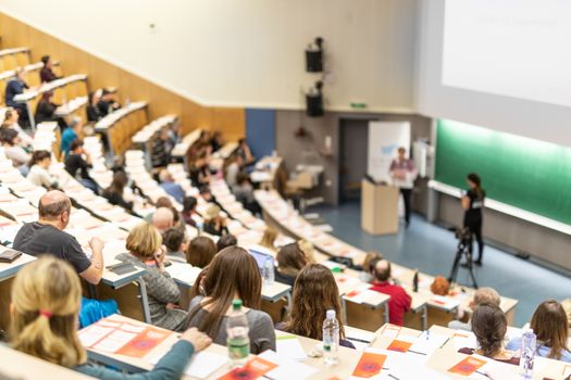 Conference and Presentation. Audience at the conference hall. Business and Entrepreneurship. Faculty lecture and workshop. Audience in the lecture hall. Academic education. Participants making notes.