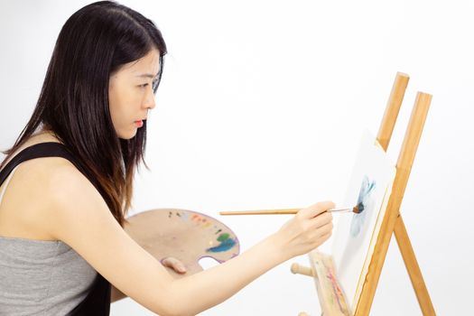 Artist painting oil painting on an easel