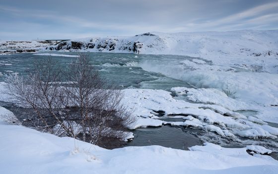 Panoramic image of the frozen waterfall Urridafoss, Iceland, Europe