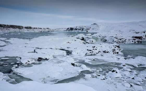 Panoramic image of the frozen waterfall Urridafoss, Iceland, Europe