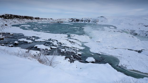 Panoramic image of the frozen waterfall Urridafoss, Iceland, Europe