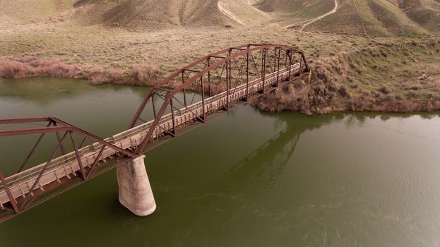 walking bridge going over a large river