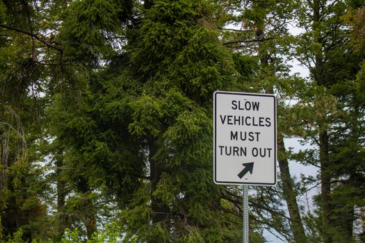 Slow car turn out while going down a road out in the country