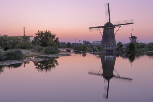 Historic windmills at Kinderdijk, The Netherlands, in beautiful twilight.