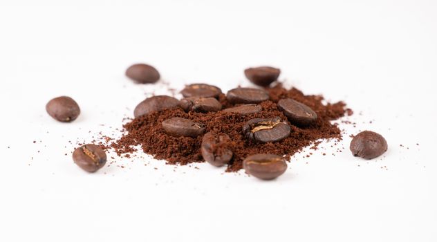 roasted coffee bean with powder isolated on white background