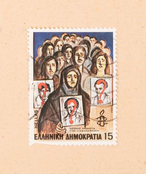 GREECE - CIRCA 1982: A stamp printed in Greece shows an image of people searching their missing relatives, circa 1982