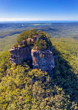 The pyramid shaped mountain has a stony crown top. From a distance it resembled a pigeon house and so named, Aboriginals say it resembles a womans breast with erect nipple. Aerial views