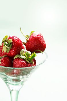 Few strawberry fruits in nice glass bowl