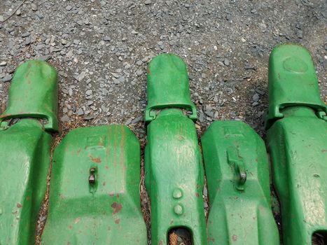 large green metal excavating or mining claw or scoop machine part