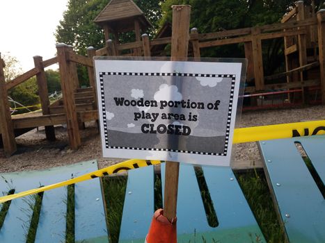 wooden portion of play area is closed sign on playground
