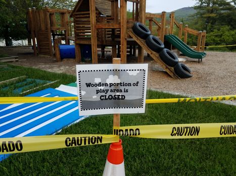 wooden portion of play area is closed sign on playground