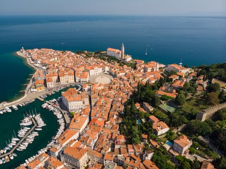 Aerial view of old town Piran. Splendid summer day on Adriatic Sea. Beautiful cityscape of Slovenia, Europe. Traveling concept background. Magnificent Mediterranean landscape.