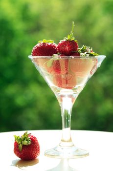 Few strawberry fruits in nice glass bowl