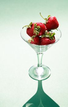 Few strawberry fruits in nice glass bowl
