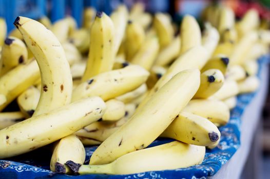 provision and sale of bananas on a table in the street market.
