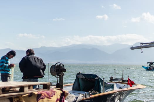a good looking seascape shoot with some wooden boats - sailors at shoot. photo has taken at izmir/turkey.