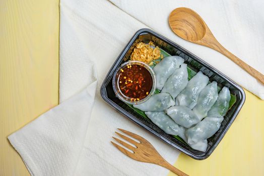 steamed chives dumplings served with spicy chili sauce , asian style cuisine