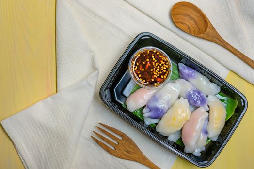 steamed chives dumplings served with spicy chili sauce , asian style cuisine