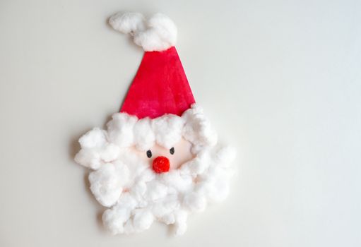 Child artwork, handmade Santa Claus on white background.