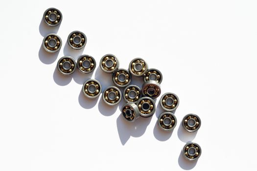 Industrial concept. Lot of ball bearings on white background