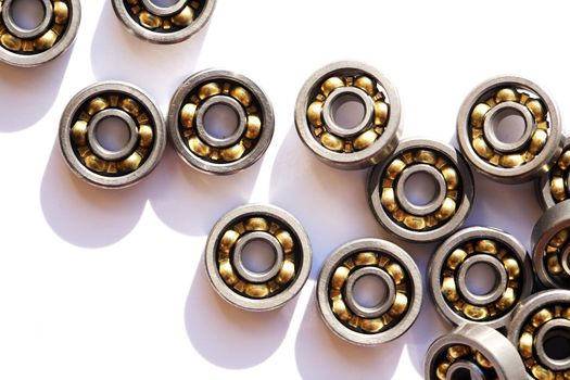 Industrial concept. Lot of ball bearings on white background