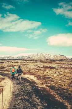 Two Young Women Hiking On A Trail In Iceland With Copy Space