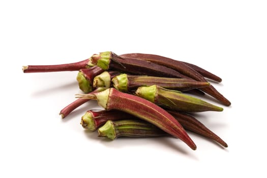 Fresh organic red okra isolated on a white background.