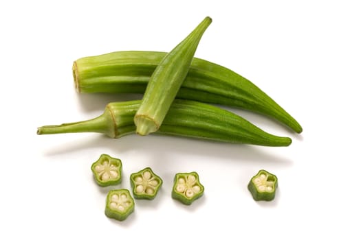 Fresh organic green okra isolated on a white background.