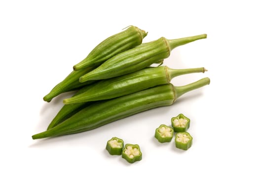 Fresh organic green okra isolated on a white background.