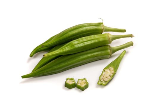 Fresh organic green okra isolated on a white background.