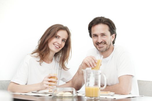Portrait of couple having breakfast together, isolated on white background