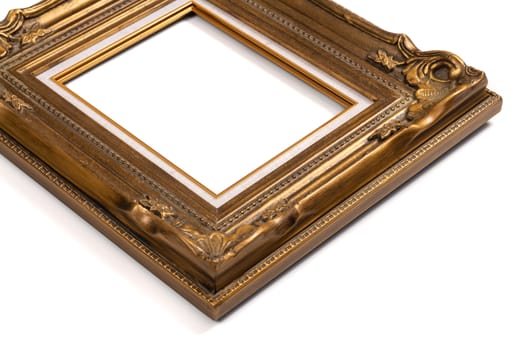 Ornate wood golden picture frame isolated on white.