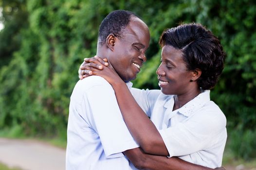 happy young couple embracing face to face in campaign