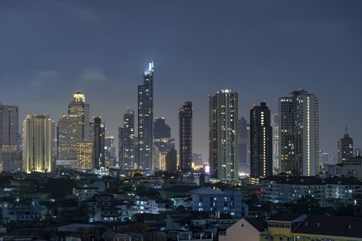 High-rise building in the capital city of Thailand Bangkok office area Night light from the building	

