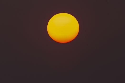 The evening or morning sun can be seen with the naked eye. The sun is red because of the dust and atmosphere.