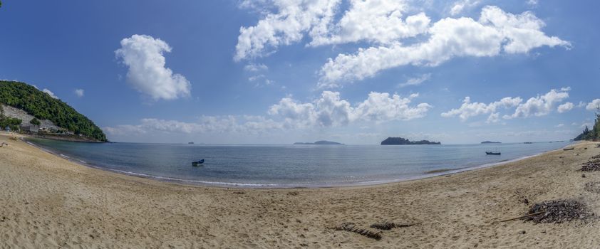 The sea and the beach at noon. The bright sky, the clouds are white.​Sea atmosphere at Sairee Beach, Chumphon Province, March 2019