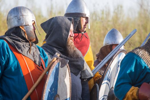 Group of slav warriors in reenactment battle rehearsal training