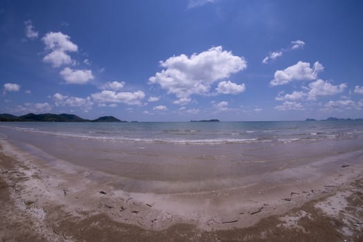 Daytime beach wide angle. Sairee Beach, March 2019. Fluffy white clouds and blue skies.