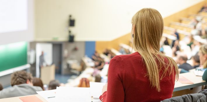 Conference and Presentation. Audience at the conference hall. Business and Entrepreneurship. Faculty lecture and workshop. Audience in the lecture hall. Academic education. Student making notes.