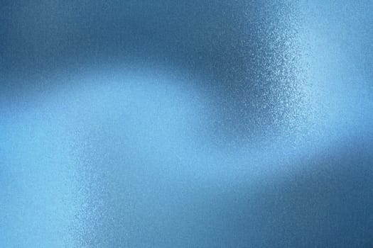 Glowing brushed blue foil metallic sheet, abstract texture background