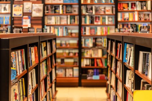 various books on shelves at a big book store. photo has taken at izmir/turkey.