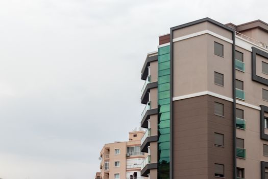 a corner shoot from a tall modern building with brown and cream colors. photo has taken at izmir/turkey.