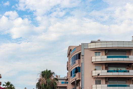 a wide corner shoot from an modern building with balcony - sky landscape as background. photo has taken at izmir/turkey.