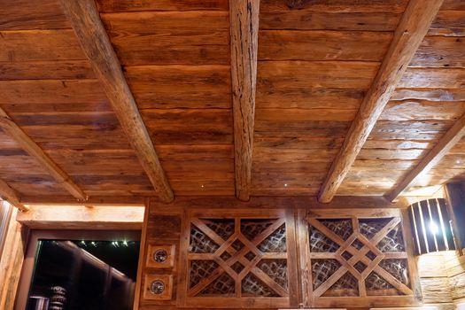 Handmade bath in the spa complex. The bath is trimmed with planks and hay.