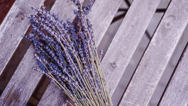 Dried lavender bunches on wooden table background